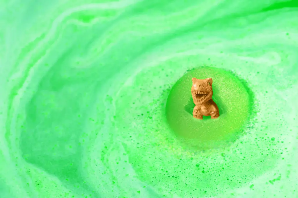 GreenDinoBathBombFizzinginbath.webp